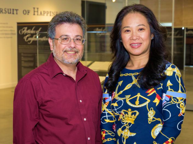 Two Kean faculty members standing in a gallery