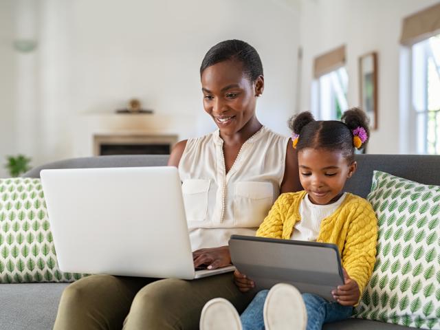 Kean Global student studies at home with her child