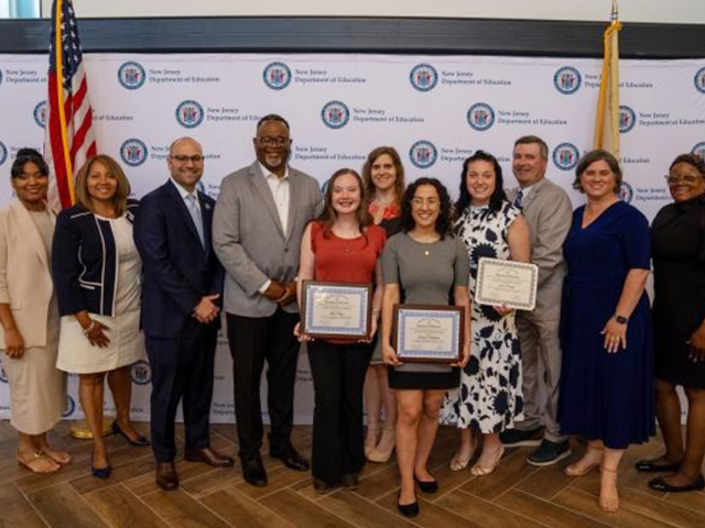 Kean President Repollet and education officials pose with the student intern award winners.