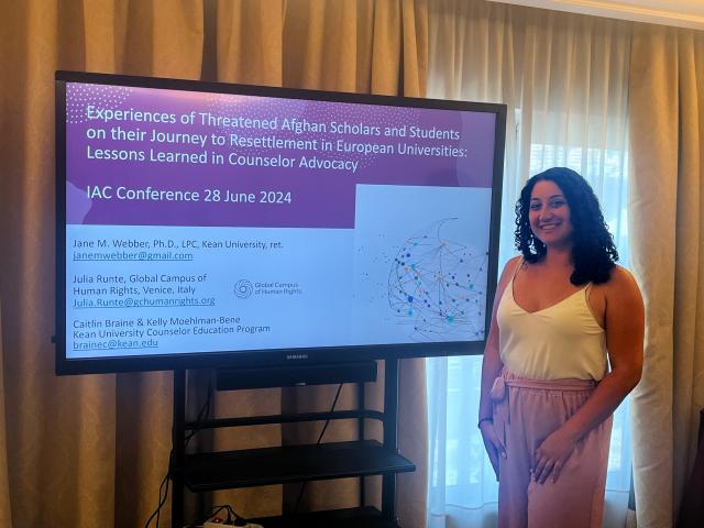 Kean counseling graduate student Caitlin Braine presenting her research in Italy