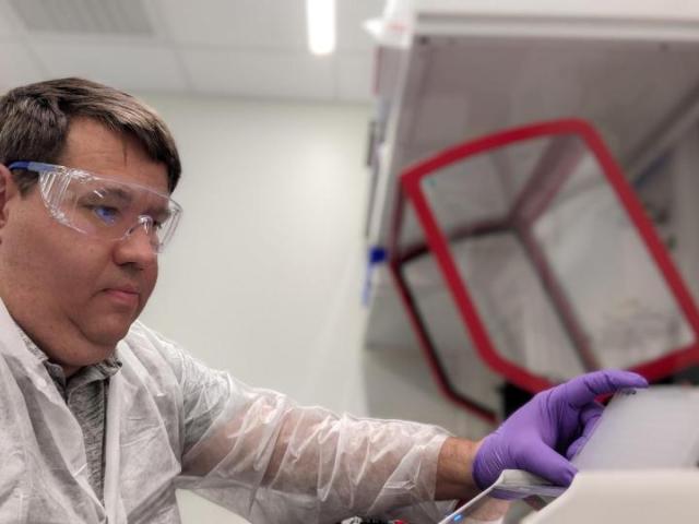 Lance Marquardt is working in a lab
