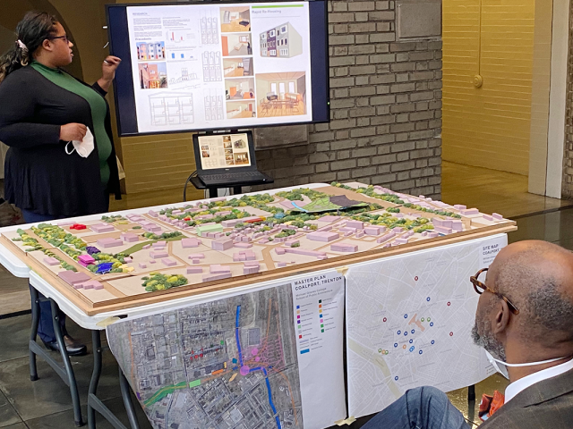 The Trenton Coalport project is underway. People work with maps of the area.