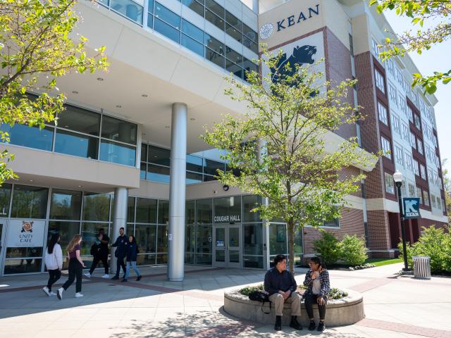 Campus life at Kean University. Students pictured outside Cougar Hall.