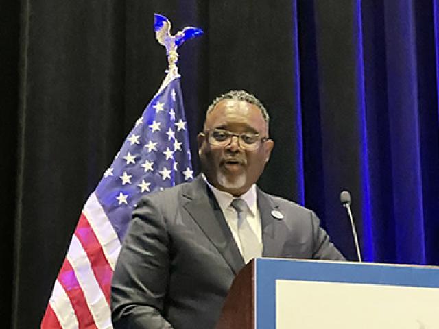 Kean President Dr. Lamont O. Repollet at podium at 2024 DNC Caucus