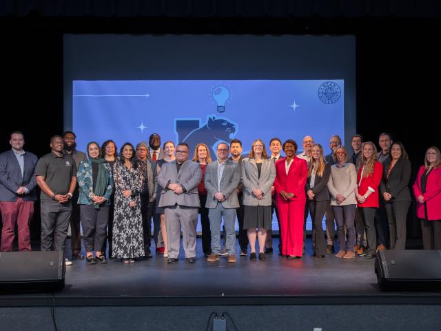 Kean staff members on stage after presenting ideas in the Think Tank Hackathon