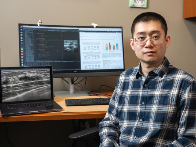 Kean researcher Kuan Huang is pictured in his office