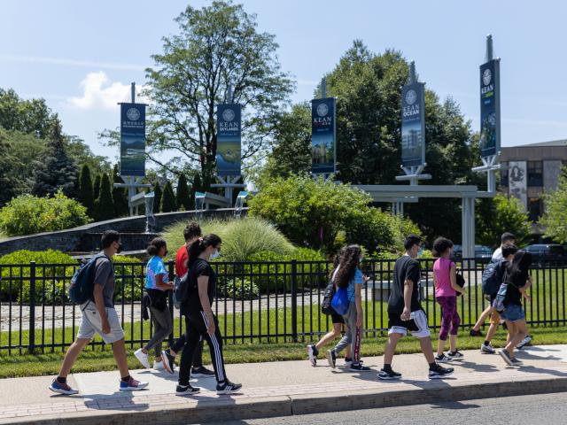 Kean Scholar Academy students walk past the University fountain during their first tour of campus in 2021