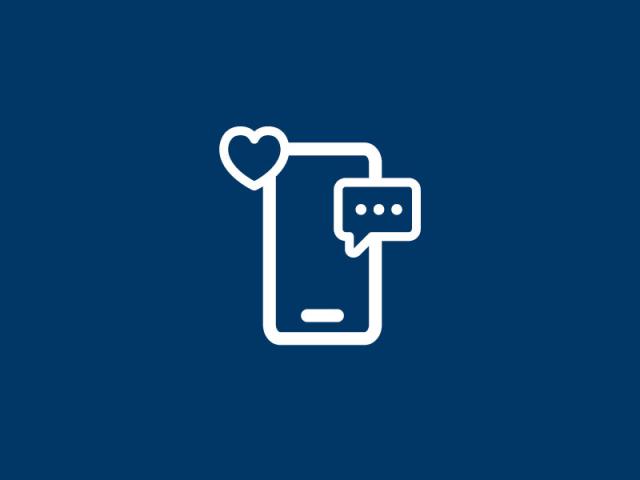 social media icon of a cellular phone with a text bubble and heart reaction