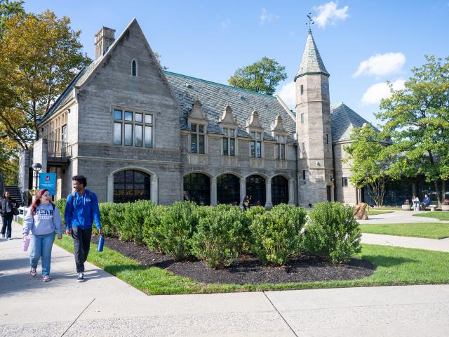 Students Walking with Building in Background
