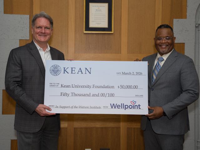 Oversized check presented to Kean University President Lamont O. Repollet