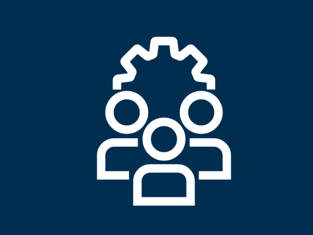 A group of human figures with a gear behind them 