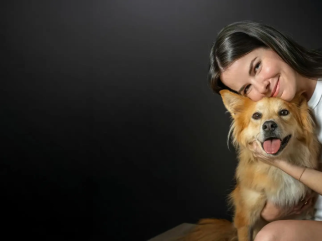 Woman holding a dog