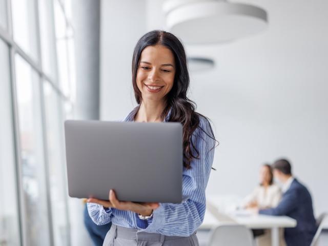 An employee views her laptop