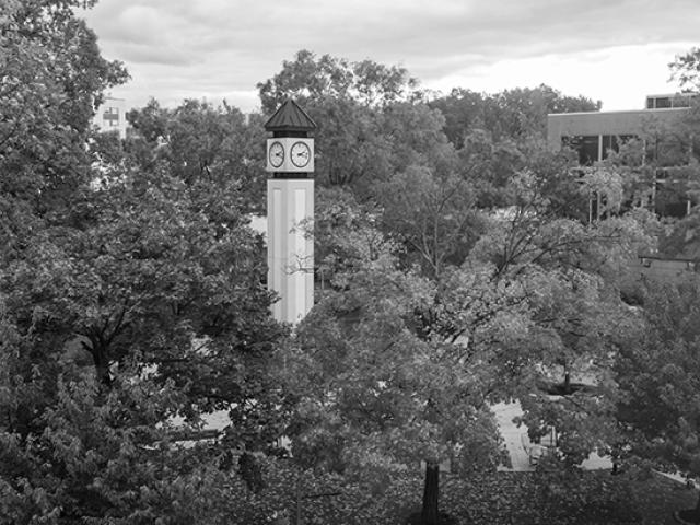 The clocktower on Kean's Union campus amid brilliant fall foliage