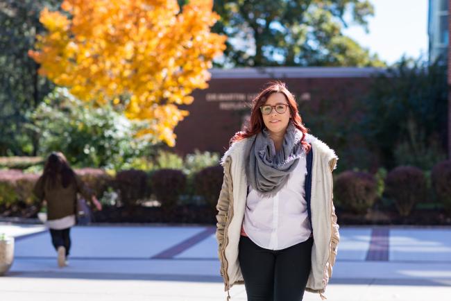 Kean female student walks through campus