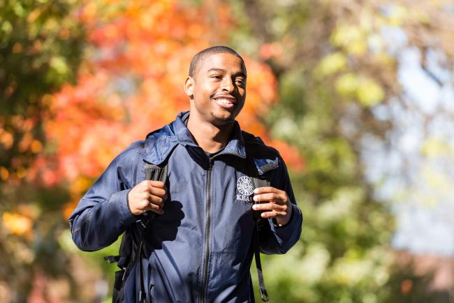 student walking through kean university's campus