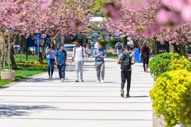 Kean University students on campus during spring semester, walking through