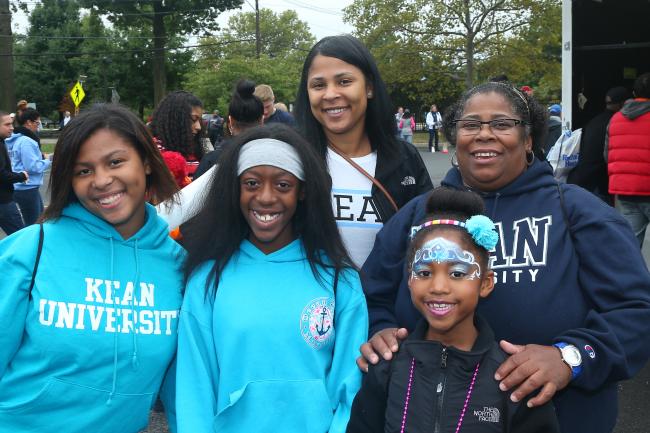 Family of five wearing Kean sweatshirts