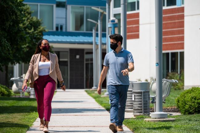 Students walk near residence halls