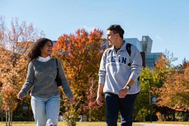 Kean students with fall foliage in the background
