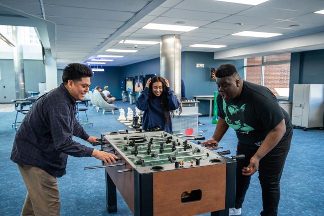 Kean students in the game room