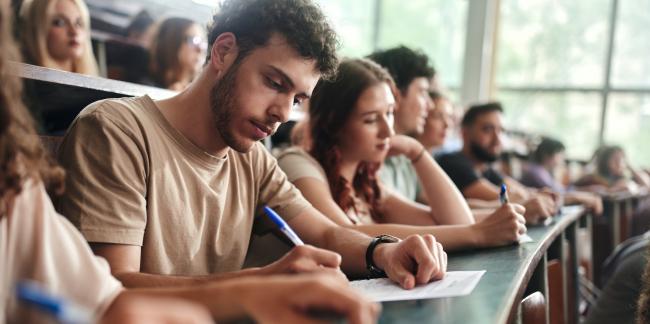 A group of students take the Praxis exam