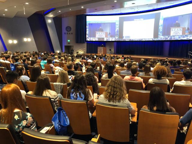 Students in auditorium watching Presentation
