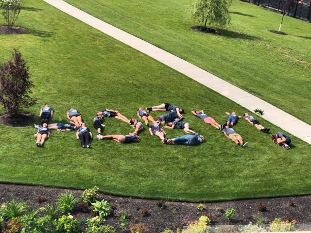 people on the launch spelling kean with their bodies