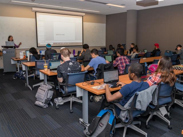 Students learn in computer science classroom