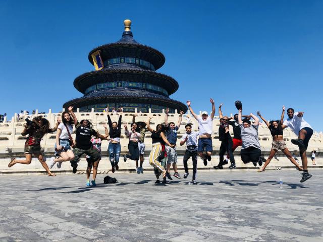 Study Abroad students in China in front of a building they visited