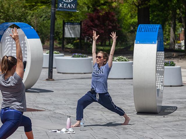 A yoga session on Kean's campus outside Miron Student Center.