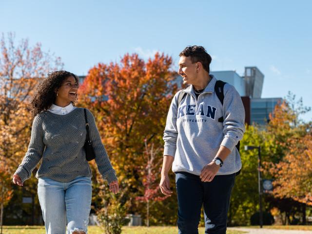 Kean students with fall foliage in the background
