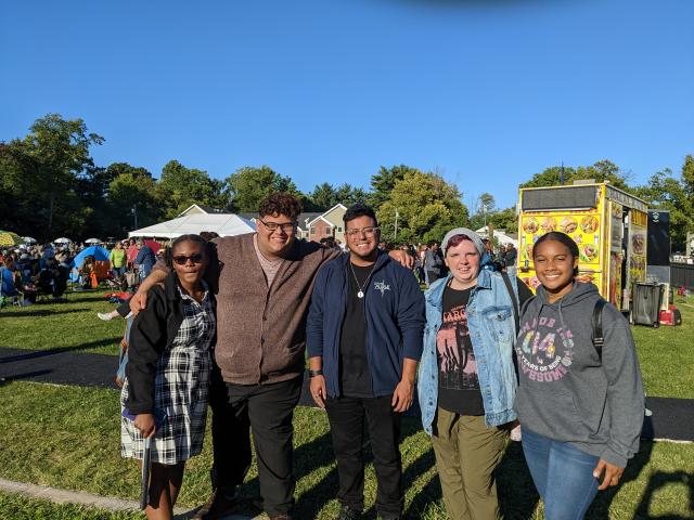 A group of five Kean students pose at the Jazz and Roots Festival