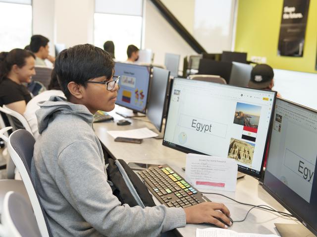 Project Adelante student works on a computer project