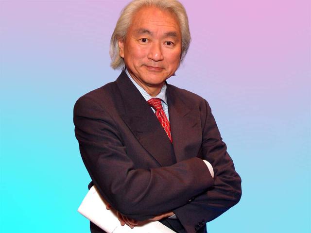 Michio Kaku with crossed arms and holding a paper. White hair, white male