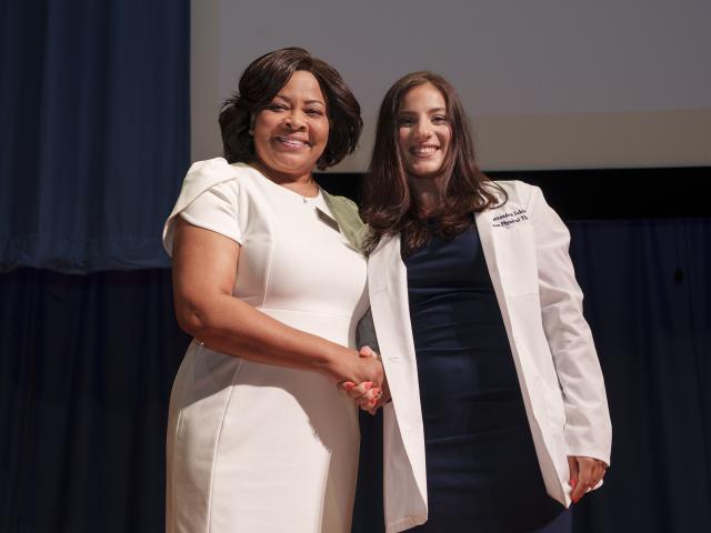 Dr. Elizabeth Locke with student at White Coat Ceremony