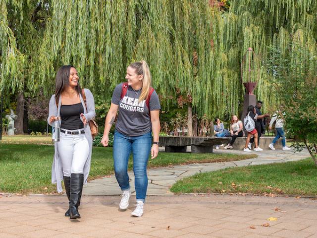 Two students walking outdoors on the Kean campus