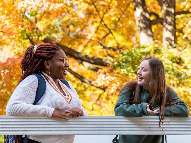 Two students talking together outside