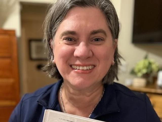 Karen Grove poses with her latest book.