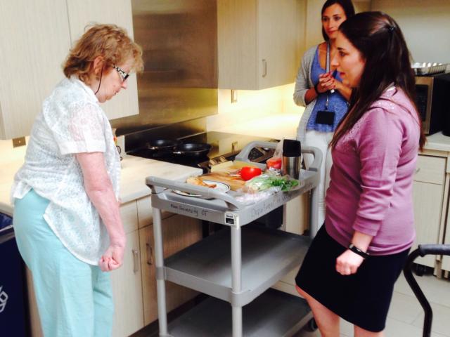 Kean OT students assist a patient