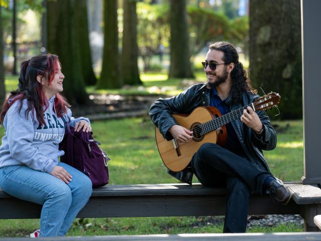 Students Sitting on Bench and Talking