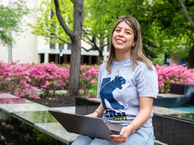 A Kean student with a laptop
