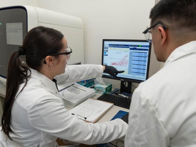 Two researchers at work in the Kean Diagnostic Laboratory