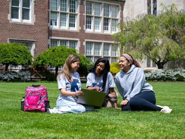 A group of Kean students reclining on a lawn