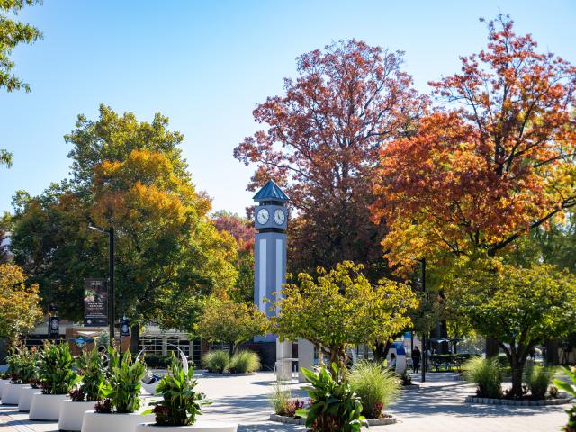 A fall foliage shot of the Kean clock tower
