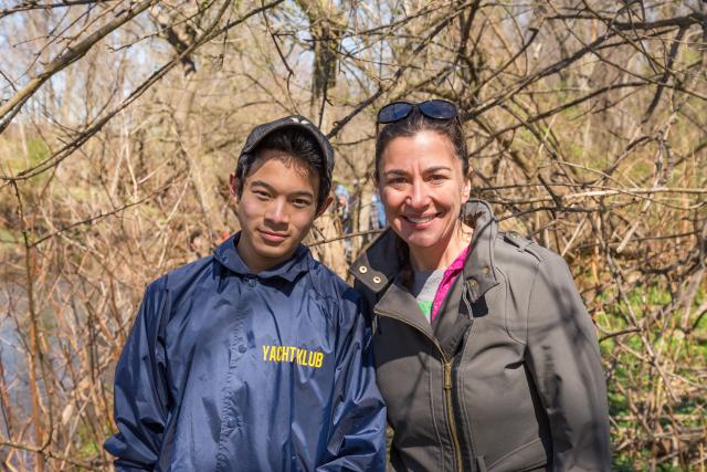 Professor Daniela Shebitz cleans up local river with students on Earth Day.