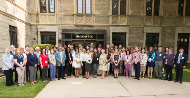 The new members of Kean University's faculty pose outside Kean Hall.