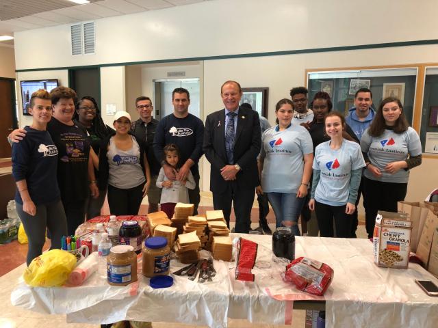 Former State Sen. Raymond Lesniak poses with volunteers who commemorated 9/11 with service.
