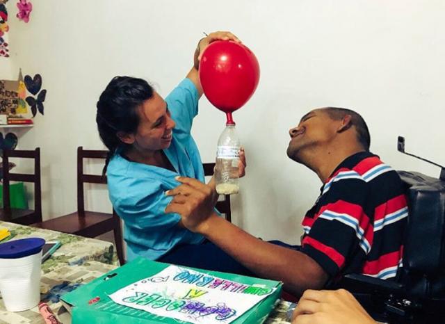 A Kean occupational therapy student works with a client in Costa Rica