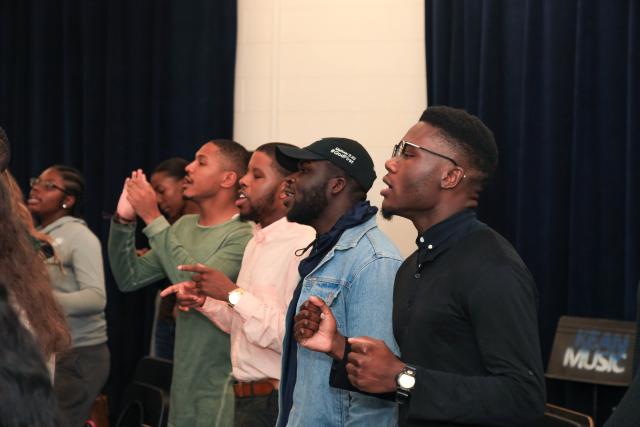 A section of the choir rehearses